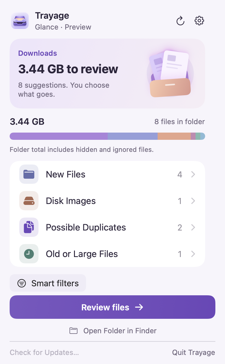 Trayage’s Glance menu-bar view showing a Downloads summary, file groups, and the Review files button.
